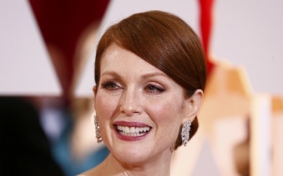 Julianne Moore, best actress nominee for her role in "Still Alice,"  arrives at the 87th Academy Awards in Hollywood, California